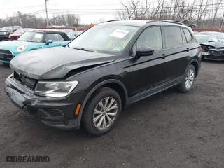 2018 Volkswagen Tiguan S with VIN 3VV1B7AX9JM091210, listed as a IAAI auction lot 41683380 with 63,627 mi miles. Bid and sale history available at carsss.com. Image 2.