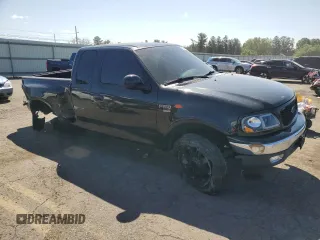 1999 Ford F-150 XL с VIN 2FTRX08L4XCA00426, выставлен на аукционе Copart как лот 68354464 с пробегом 157 539 миль миль и Списание • Salvage title. История ставок и продаж доступна на DreamBid. Изображение 4.