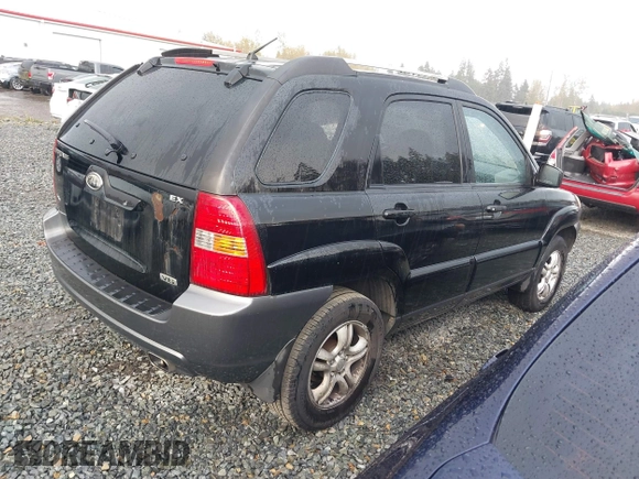 2005 Kia Sportage LX with VIN KNDJF723557054234, listed as a IAAI auction lot 40652851 with 220,215 mi miles and . Bid and sale history available at carsss.com. Image 4.