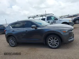 2021 Mazda CX-5 Grand Touring with VIN JM3KFBDM2M0431484, listed as a IAAI auction lot 42547665 with 34,757 mi miles and . Bid and sale history available at DreamBid. Image 14.