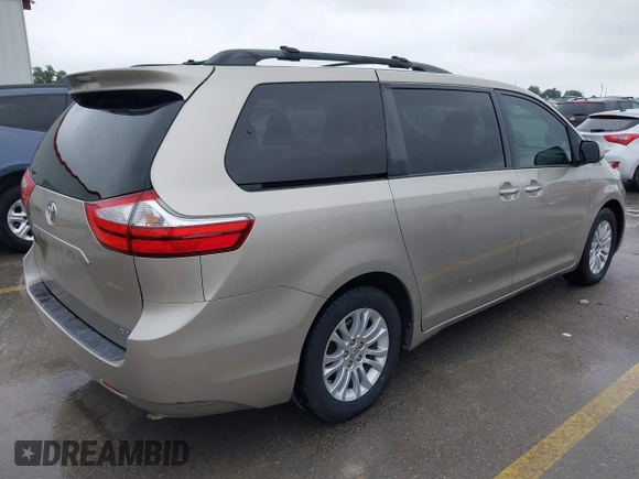 2015 Toyota Sienna XLE with VIN 5TDYK3DCXFS578888, listed as a IAAI auction lot 42187384 with 105,287 mi miles and . Bid and sale history available at DreamBid. Image 4.