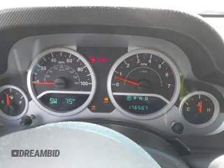 2007 Jeep Wrangler Unlimited Sahara with VIN 1J4GA59117L216687, listed as a IAAI auction lot 42188257 with 176,507 mi miles and . Bid and sale history available at DreamBid. Image 7.