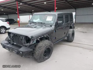 2019 Jeep Wrangler Unlimited Sport with VIN 1C4HJXDG9KW558672, listed as a IAAI auction lot 41218292 with 61,057 mi miles. Bid and sale history available at carsss.com. Image 2.