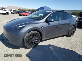 2023 Tesla Model Y Performance z VIN 7SAYGDEF1PF598312, wystawiony jako Copart lot #56075405 z przebiegiem 21 523 mil mil oraz Szkoda całkowita • Salvage title. Historia ofert i sprzedaży dostępna na DreamBid. Obrazek 1.