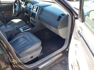 2005 Chrysler 300 with VIN 2C3AA63HX5H649107, listed as a IAAI auction lot 41748562 with 173,803 mi miles. Bid and sale history available at carsss.com. Image 5.