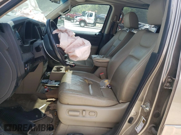 2011 Honda Ridgeline RTL with VIN 5FPYK1F59BB007045, listed as a Copart auction lot 61263715 with 159,527 mi miles and Clean title. Bid and sale history available at DreamBid. Image 7.