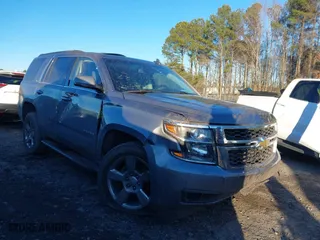 2019 Chevrolet Tahoe LT with VIN 1GNSCBKC8KR123828, listed as a IAAI auction lot 41256573 with 125,618 mi miles. Bid and sale history available at carsss.com. Image 1.