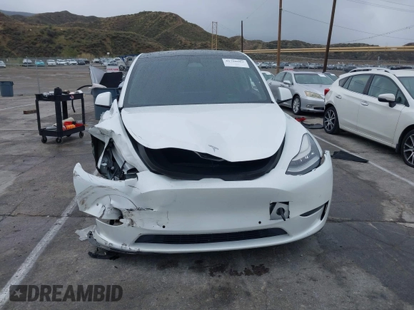 2020 Tesla Model Y Long Range with VIN 5YJYGDEE2LF022484, listed as a IAAI auction lot 41798662 with 108,978 mi miles and . Bid and sale history available at DreamBid. Image 12.