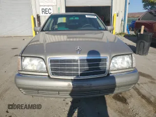 1995 Mercedes-Benz S 320 with VIN WDBGA32E6SA256435, listed as a Copart auction lot 77104234 with 309,498 mi miles and Clean Title. Bid and sale history available at DreamBid. Image 5.