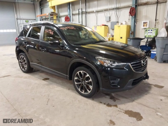 2016 Mazda CX-5 Grand Touring with VIN JM3KE2DY9G0635368, listed as a IAAI auction lot 41699616 with 240,619 mi miles. Bid and sale history available at carsss.com. Image 1.