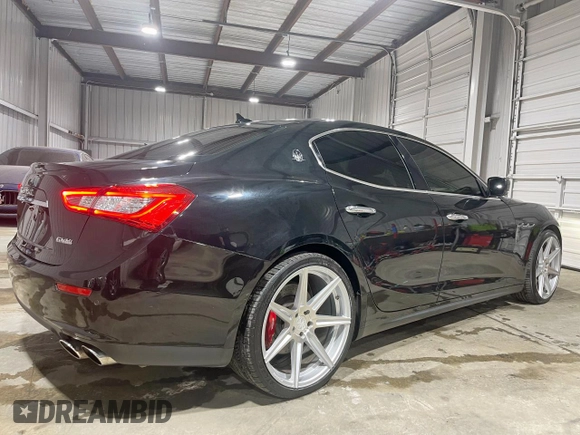 2014 Maserati Ghibli S Q4 z VIN ZAM57RTA9E1112724, wystawiony jako Copart lot #57189295 z przebiegiem 45 525 mil mil oraz Szkody całkowita. Historia ofert i sprzedaży dostępna na DreamBid. Obrazek 4.