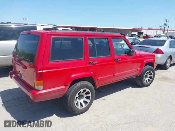 1998 Jeep Cherokee Sport with VIN 1J4FT68S2WL256846, listed as a IAAI auction lot 41998490 with 198,936 mi miles. Bid and sale history available at carsss.com. Image 4.
