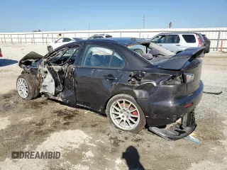 2015 Mitsubishi Lancer Evolution GSR with VIN JA32W8FV8FU023812, listed as a Copart auction lot 48822935 with 105,463 mi miles and Salvage Title. Bid and sale history available at carsss.com. Image 2.