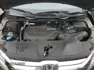 2018 Honda Odyssey Elite z VIN 5FNRL6H94JB107589, wystawiony jako Copart lot #58347385 z przebiegiem 98 761 mil mil oraz Szkody całkowita. Historia ofert i sprzedaży dostępna na DreamBid. Obrazek 12.