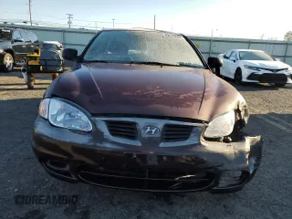 1999 Hyundai Elantra z VIN KMHJW25F1XU128645, wystawiony jako Copart lot #82970984 z przebiegiem 118 048 mil mil oraz Szkoda całkowita • Salvage title. Historia ofert i sprzedaży dostępna na DreamBid. Obrazek 5.