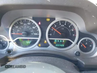 2007 Jeep Wrangler Unlimited Sahara with VIN 1J4GA59187L189519, listed as a IAAI auction lot 41204036 with 165,428 mi miles and . Bid and sale history available at DreamBid. Image 7.