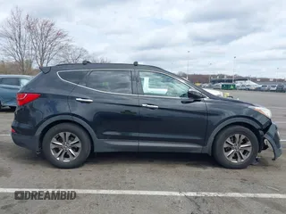 2014 Hyundai Santa Fe z VIN 5XYZUDLBXEG162476, wystawiony jako IAAI lot #41910671 z przebiegiem 146 607 mil mil oraz . Historia ofert i sprzedaży dostępna na DreamBid. Obrazek 13.