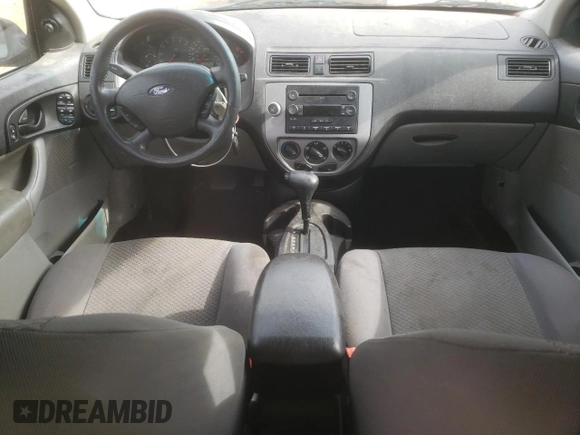 2006 Ford Focus S with VIN 1FAHP37N76W180039, listed as a Copart auction lot 58328565 with 220,696 mi miles and Salvage title. Bid and sale history available at DreamBid. Image 8.