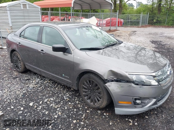 2011 Ford Fusion Hybrid z VIN 3FADP0L32BR238153, wystawiony jako IAAI lot #42113064 z przebiegiem 145 932 mil mil oraz . Historia ofert i sprzedaży dostępna na DreamBid. Obrazek 1.