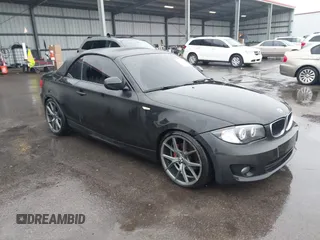 2012 BMW 1 Series 128i with VIN WBAUN1C51CVH84311, listed as a IAAI auction lot 41551912 with 147,052 mi miles and . Bid and sale history available at DreamBid. Image 1.
