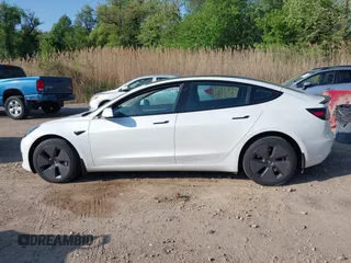 2023 Tesla Model 3 with VIN 5YJ3E1EA3PF617460, listed as a IAAI auction lot 42154401 with 9,578 mi miles and . Bid and sale history available at DreamBid. Image 13.