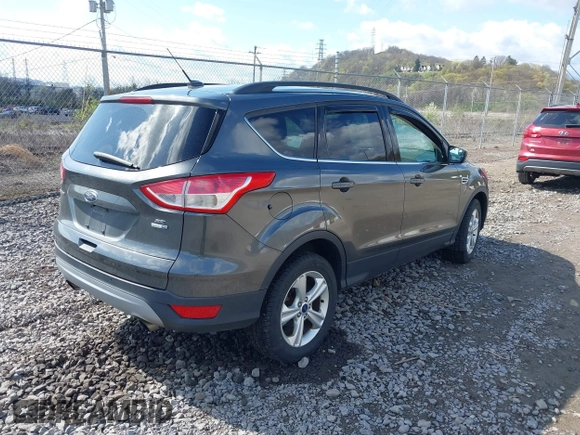 2016 Ford Escape SE with VIN 1FMCU9GX5GUA06660, listed as a IAAI auction lot 42043031 with 87,719 mi miles. Bid and sale history available at carsss.com. Image 4.