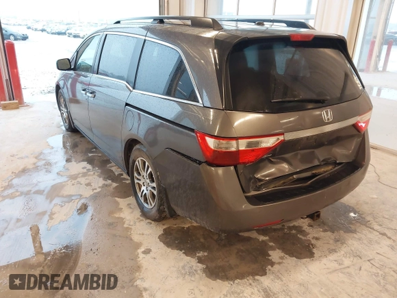 2012 Honda Odyssey EX-L with VIN 5FNRL5H66CB127507, listed as a IAAI auction lot 41961465 with 228,972 mi miles and . Bid and sale history available at carsss.com. Image 3.