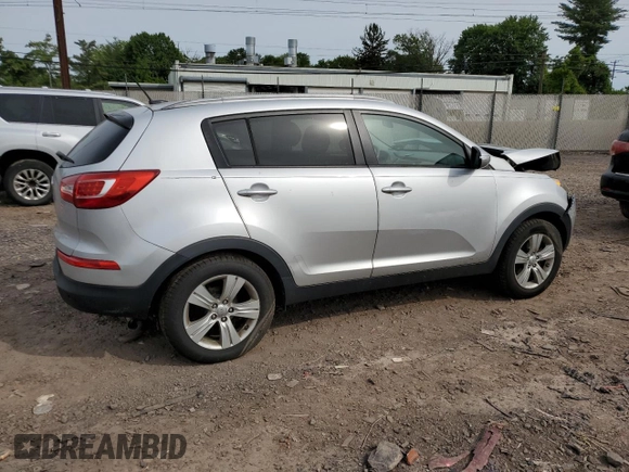 2012 Kia Sportage LX z VIN KNDPB3A29C7264856, wystawiony jako Copart lot #58397685 z przebiegiem 144 621 mil mil oraz Szkoda całkowita • Salvage title. Historia ofert i sprzedaży dostępna na DreamBid. Obrazek 3.