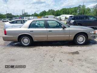 2001 Mercury Grand Marquis LS z VIN 2MEFM75W31X704182, wystawiony jako IAAI lot #42086175 z przebiegiem 177 892 mil mil oraz . Historia ofert i sprzedaży dostępna na DreamBid. Obrazek 13.