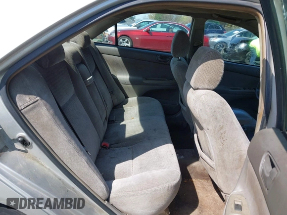 2003 Toyota Camry LE z VIN 4T1BF32K93U053750, wystawiony jako IAAI lot #41930830 z przebiegiem Nie podano mil oraz . Historia ofert i sprzedaży dostępna na DreamBid. Obrazek 8.
