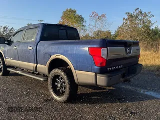 2016 Nissan Titan XD Platinum Reserve with VIN 1N6BA1F25GN500038, listed as a Copart auction lot 84605344 with 205,859 mi miles and Salvage Title. Bid and sale history available at carsss.com. Image 3.