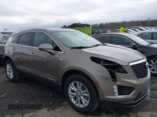 2023 Cadillac XT5 FWD Luxury z VIN 1GYKNAR45PZ140440, wystawiony jako IAAI lot #41723317 z przebiegiem 25 124 mil mil oraz . Historia ofert i sprzedaży dostępna na DreamBid. Obrazek 13.