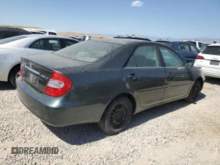 2002 Toyota Camry LE z VIN JTDBE32K120068644, wystawiony jako Copart lot #61168915 z przebiegiem 210 149 mil mil oraz Czysty tytuł • Clean title. Historia ofert i sprzedaży dostępna na DreamBid. Obrazek 3.