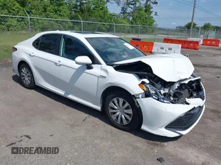 2019 Toyota Camry Hybrid LE z VIN 4T1B31HK2KU510238, wystawiony jako IAAI lot #42219542 z przebiegiem 110 487 mil mil oraz . Historia ofert i sprzedaży dostępna na DreamBid. Obrazek 1.