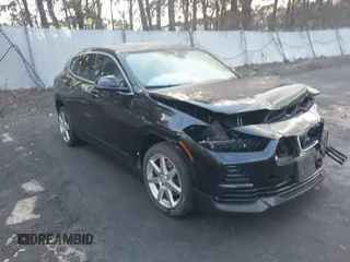 2022 BMW X2 xDrive28i z VIN WBXYJ1C02N5T91876, wystawiony jako IAAI lot #41475739 z przebiegiem Nie podano mil oraz . Historia ofert i sprzedaży dostępna na DreamBid. Obrazek 1.