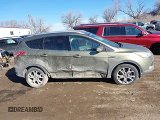 2014 Ford Escape Titanium with VIN 1FMCU9J96EUA15990, listed as a IAAI auction lot 41667046 with 203,202 mi miles. Bid and sale history available at carsss.com. Image 13.