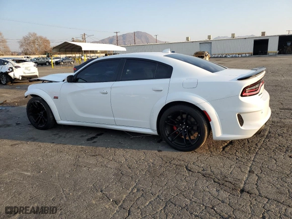 2022 Dodge Charger Scat Pack Widebody with VIN 2C3CDXGJ4NH107018, listed as a Copart auction lot 43189305 with 57,128 mi miles and Salvage Title. Bid and sale history available at carsss.com. Image 2.