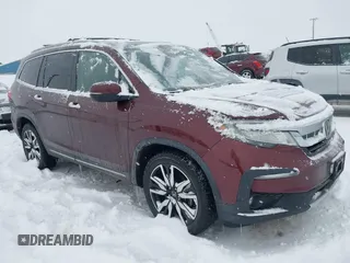 2019 Honda Pilot Touring 8-Passenger z VIN 5FNYF6H95KB036374, wystawiony jako IAAI lot #41575839 z przebiegiem 87 639 mil mil oraz . Historia ofert i sprzedaży dostępna na DreamBid. Obrazek 1.