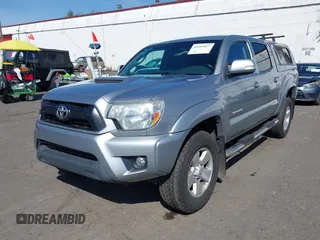 2014 Toyota Tacoma with VIN 3TMLU4EN7EM146705, listed as a IAAI auction lot 41949827 with 147,887 mi miles and . Bid and sale history available at DreamBid. Image 2.