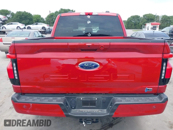 2023 Ford F-150 Lightning Pro with VIN 1FTVW1EL8PWG33656, listed as a IAAI auction lot 42260659 with 22,490 mi miles and . Bid and sale history available at DreamBid. Image 16.