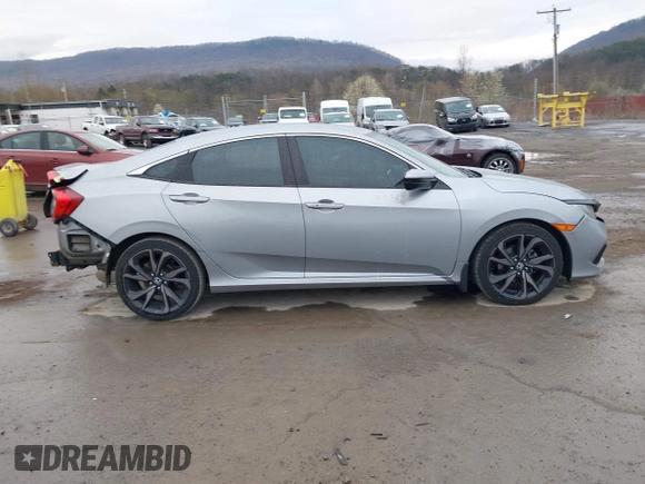 2019 Honda Civic Sport with VIN 19XFC2F81KE034047, listed as a IAAI auction lot 41995614 with 91,303 mi miles and . Bid and sale history available at DreamBid. Image 14.