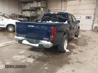 2011 GMC Canyon SLE1 with VIN 1GTH6MFE3B8123808, listed as a IAAI auction lot 41611231 with 142,877 mi miles. Bid and sale history available at carsss.com. Image 4.