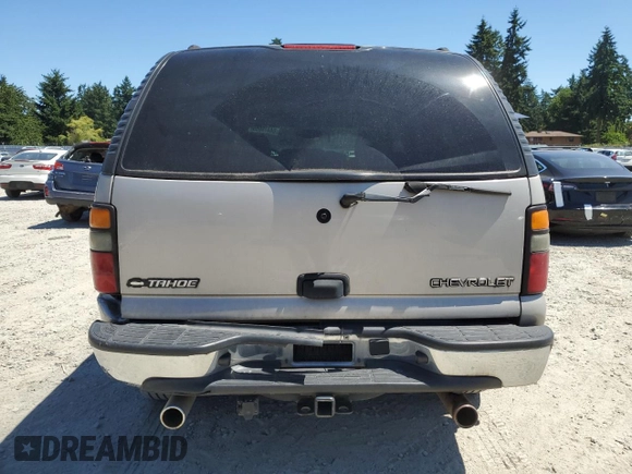 2004 Chevrolet Tahoe LS with VIN 1GNEC13V24J321605, listed as a Copart auction lot 64476065 with 176,551 mi miles and Salvage title. Bid and sale history available at DreamBid. Image 6.