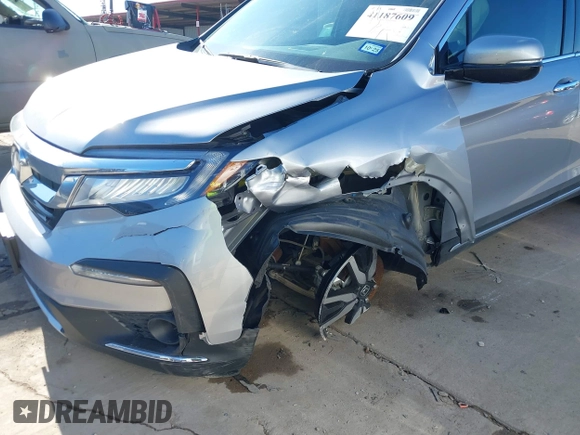 2020 Honda Pilot Touring 8-Passenger with VIN 5FNYF6H95LB021455, listed as a IAAI auction lot 41187609 with 35,589 mi miles and . Bid and sale history available at DreamBid. Image 6.
