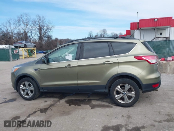 2013 Ford Escape SE with VIN 1FMCU9GX1DUB69236, listed as a IAAI auction lot 41575494 with 122,075 mi miles and . Bid and sale history available at DreamBid. Image 14.