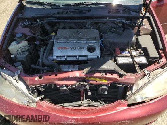 2003 Toyota Camry LE z VIN 4T1BF30K23U056007, wystawiony jako Copart lot #55187435 z przebiegiem 233 976 mil mil oraz Czysty tytuł • Clean title. Historia ofert i sprzedaży dostępna na DreamBid. Obrazek 11.