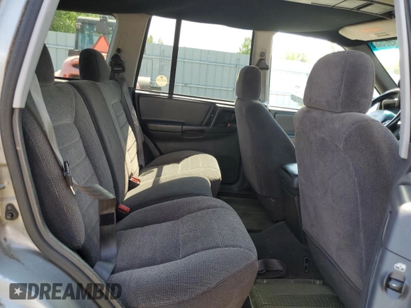 1998 Jeep Grand Cherokee Laredo z VIN 1J4GZ58S4WC278490, wystawiony jako Copart lot #62388535 z przebiegiem 133 896 mil mil oraz Czysty tytuł • Clean title. Historia ofert i sprzedaży dostępna na DreamBid. Obrazek 11.