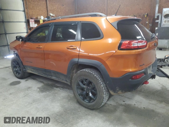 2014 Jeep Cherokee Trailhawk with VIN 1C4PJMBS0EW308775, listed as a Copart auction lot 60465125 with 117,326 mi miles and Salvage title. Bid and sale history available at DreamBid. Image 2.