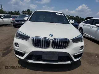 2017 BMW X1 xDrive28i with VIN WBXHT3Z3XH4A55624, listed as a Copart auction lot 59773545 with 140,251 mi miles and Salvage title. Bid and sale history available at DreamBid. Image 5.
