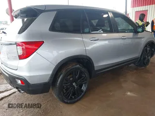 2021 Honda Passport Sport with VIN 5FNYF7H26MB014556, listed as a IAAI auction lot 41683680 with 97,829 mi miles and . Bid and sale history available at carsss.com. Image 4.